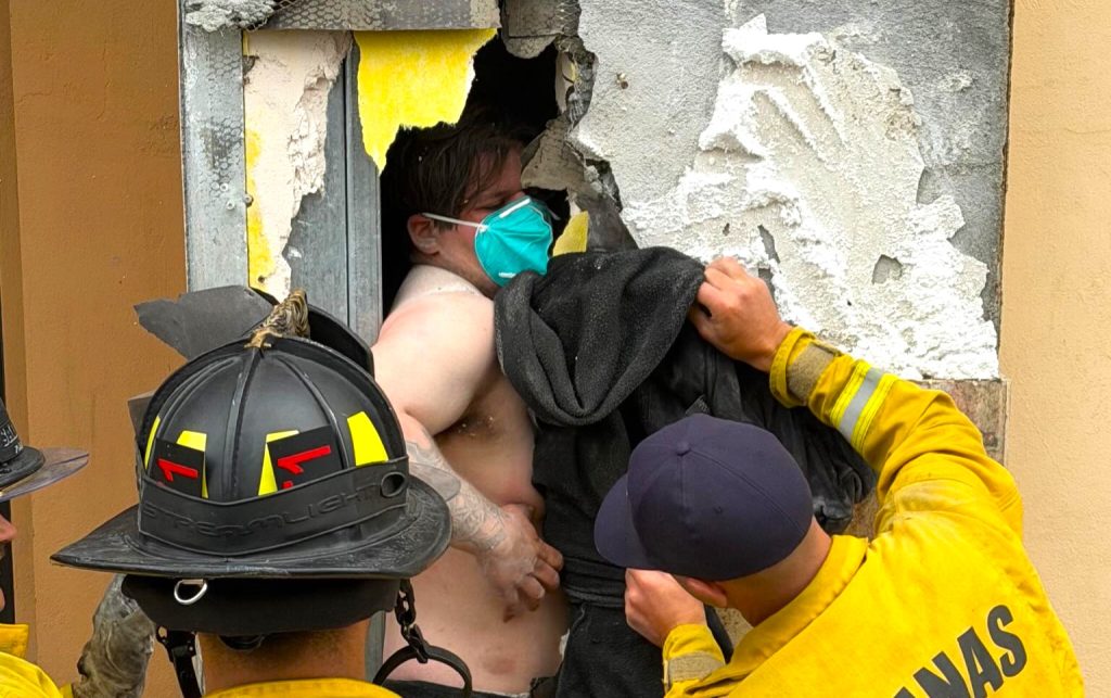 California burglar Isaac Valencia found trapped inside wall between Salinas coffee shop and cinema for 10 hours after officers heard his cries during coffee break.
