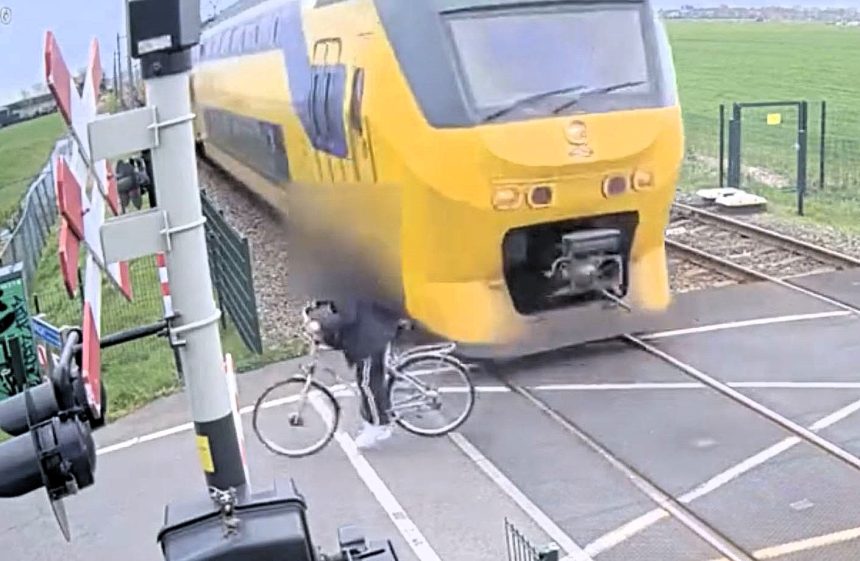 A Dutch teen cyclist missed death by inches when a speeding train narrowly avoided him at a level crossing, with rail firm ProRail releasing the footage as part of a teen safety campaign.