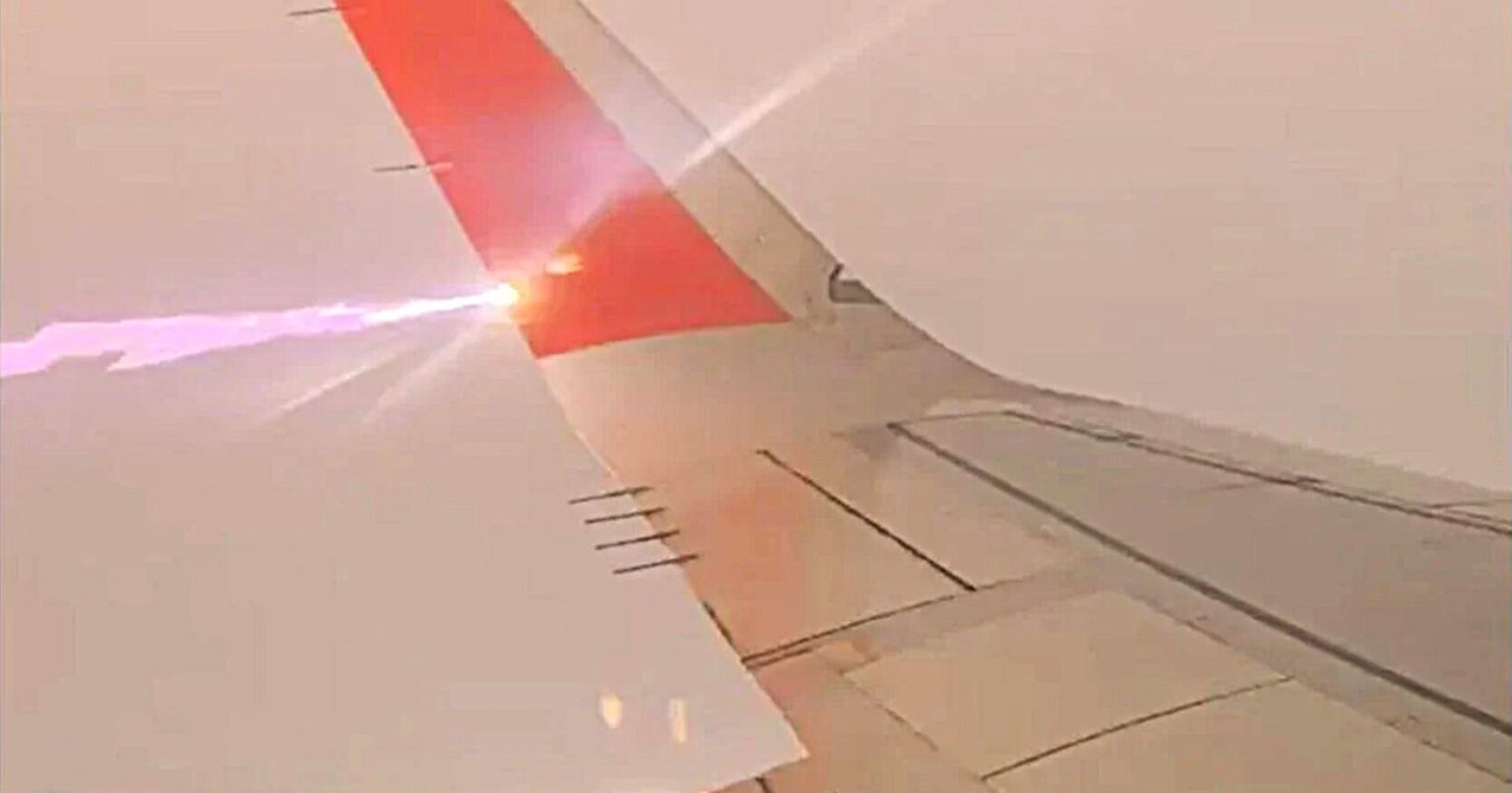 Terrifying moment lightning bolt struck Viva flight wing mid-air as plane flew from Puerto Escondido to Mexico City, sparking panic among passengers on board.