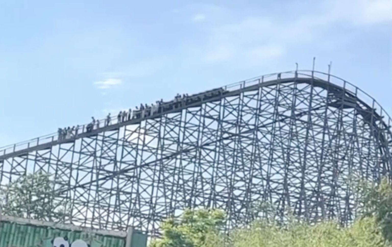 Around 20 terrified riders were forced to walk down a towering 157ft rollercoaster in China after the wooden ride broke down mid-ascent, leaving some with splinter injuries.