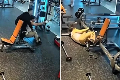 Gym goer in China narrowly escapes serious injury after weight machine topples onto him during bizarre extreme workout - sparking urgent safety inspections.