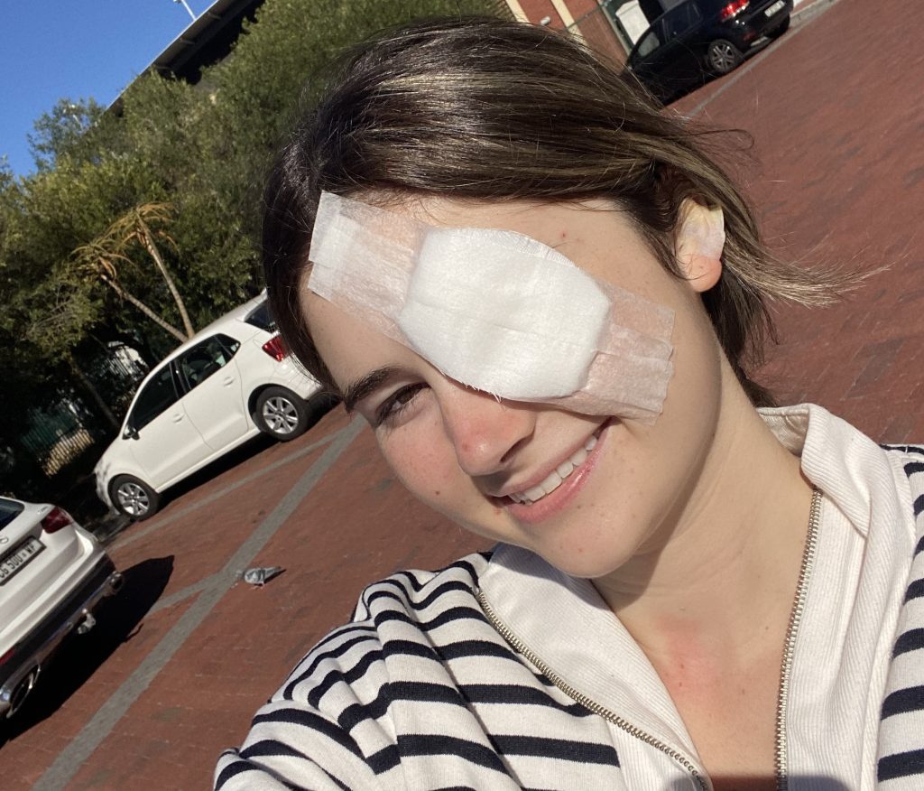 Student with rare eye cancer reveals the heartbreaking moment she first saw herself in the mirror after surgery to remove her eye - and how she learned to accept it.
