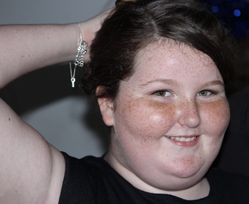 Aussie Lara, 22, shed an incredible 10 stone after years of hiding behind friends in photos - now she barely recognises her miserable former self.
