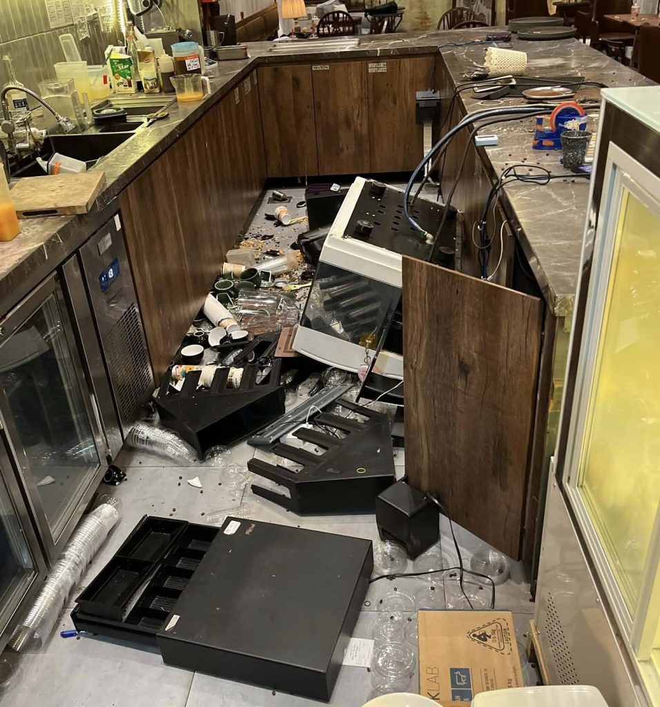 A tourist stripped off his shirt, gave diners a 10-second warning and launched into a rampage at a Vietnamese cafe - causing £14,000 damage and trapping people upstairs.