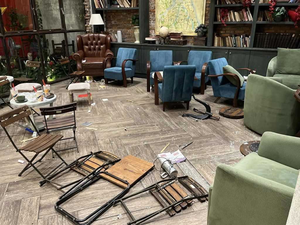 A tourist stripped off his shirt, gave diners a 10-second warning and launched into a rampage at a Vietnamese cafe - causing £14,000 damage and trapping people upstairs.