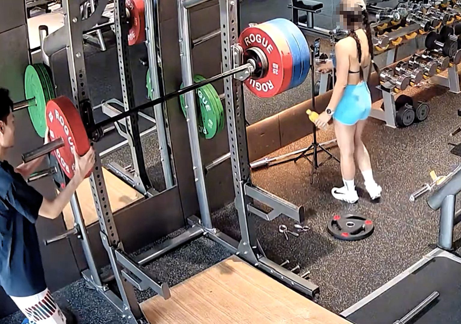 Gym goer accused of deliberately trying to injure woman by unloading weights from one side of barbell causing it to crash on her leg in shocking CCTV footage from China.