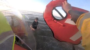 Dramatic footage shows a person trapped in quicksand at Rhyl beach being rescued by lifeboat crews just as the incoming tide rose to their waist.
