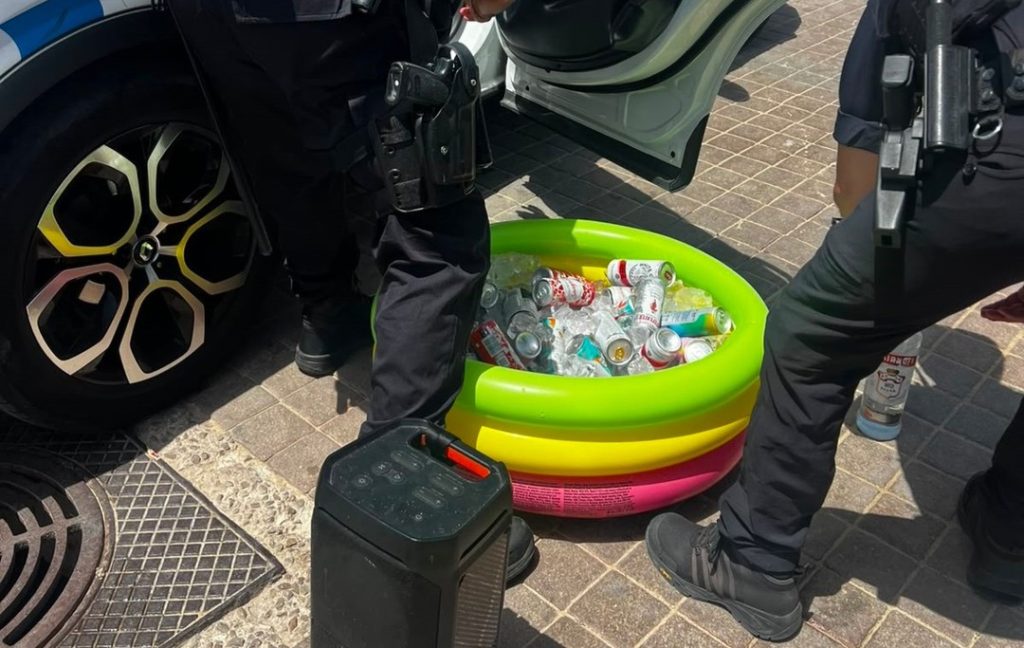 Police shut down an illegal beach party in Mallorca and confiscated 100 bottles of alcohol after a group of 20 Brits set up a tent, paddling pool full of booze and a blasting speaker.