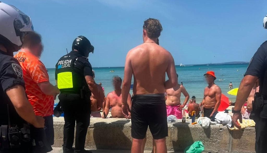 Police shut down an illegal beach party in Mallorca and confiscated 100 bottles of alcohol after a group of 20 Brits set up a tent, paddling pool full of booze and a blasting speaker.