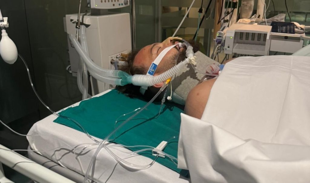 A 27-year-old Brit has been told he may never walk again after a holiday dive fractured four parts of his spine - he told bystanders he couldn't feel his legs as he lay on the beach.
