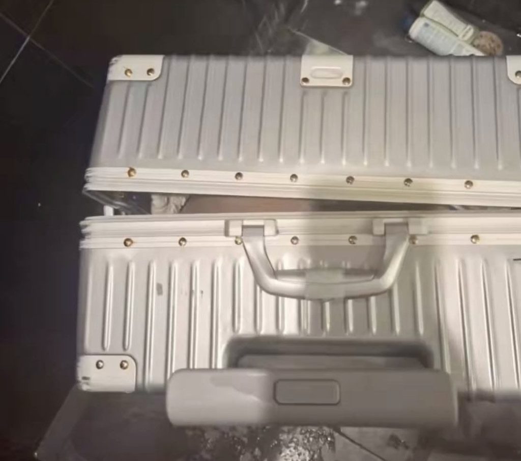 A British man is being hunted by police after a model's body was found stuffed in a suitcase in a Colombian apartment bathroom - with the shower still running when cleaning staff arrived.
