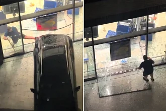 A man leapt through a smashed window and chased after suspected thieves after a car reversed through the front of a Lidl store in Canning Town, East London.