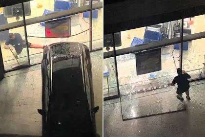 A man leapt through a smashed window and chased after suspected thieves after a car reversed through the front of a Lidl store in Canning Town, East London.
