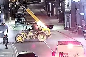 A gang used a stolen telehandler to rip a cash machine clean out of a Nationwide branch wall in a 3am ram raid, making off with tens of thousands of pounds in minutes.