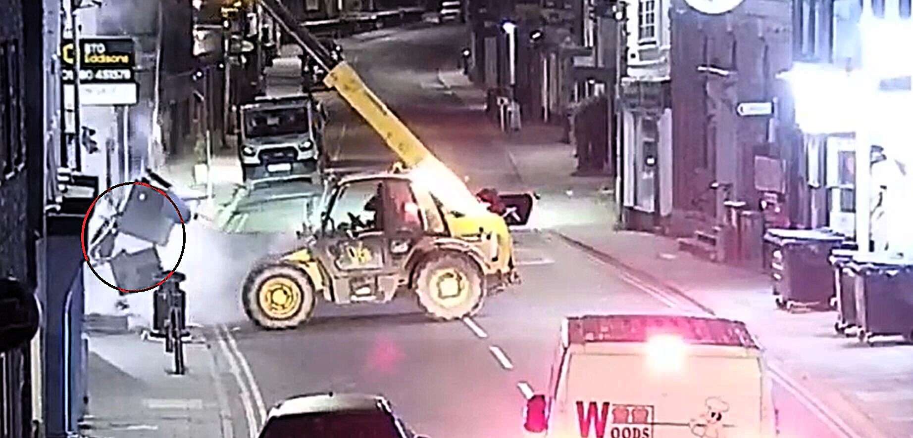 A gang used a stolen telehandler to rip a cash machine clean out of a Nationwide branch wall in a 3am ram raid, making off with tens of thousands of pounds in minutes.