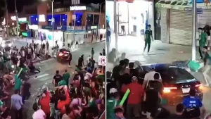 A driver ploughed through a crowd of World Cup celebrations in Mexico, injuring 17 people after suddenly accelerating as fans surrounded his car - one person was left motionless in a pool of blood.