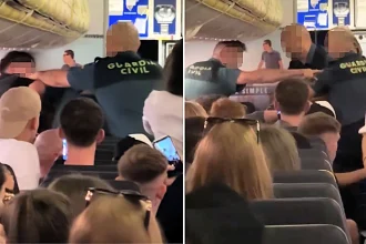 A drunk passenger punched a police officer in the face during an arrest on a Ryanair flight from Edinburgh - leaving terrified holidaymakers watching as officers wrestled him to the floor.
