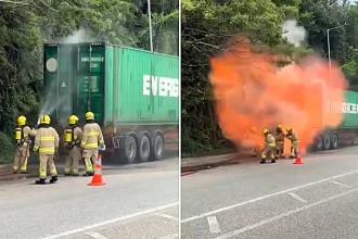 A massive fireball burst from a lorry loaded with lithium batteries in Hong Kong, sending firefighters scrambling for safety just metres away in footage that has shocked viewers online.