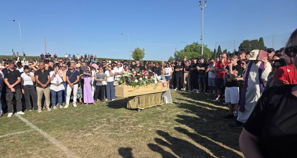 A 19-year-old footballer died in a head-on crash that burst into flames in Italy - over 1,000 mourners packed his funeral as his mother revealed he had donated his organs.