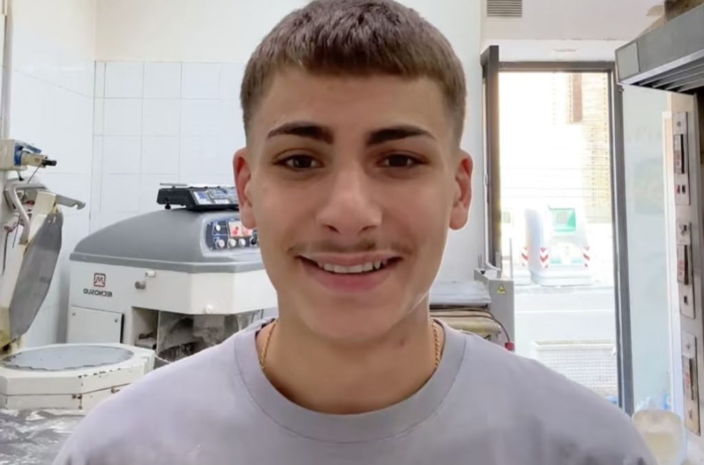 A 21-year-old footballer was shot dead outside his home in Naples after a grudge over a five-a-side foul festered for months - the suspect is a 16-year-old with clan ties.