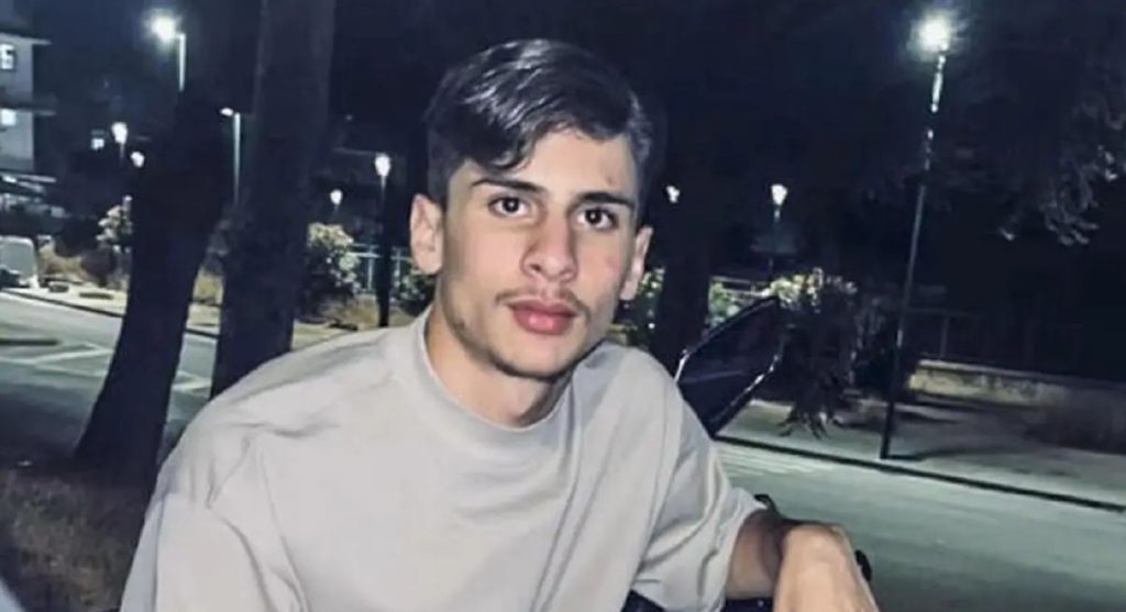A 21-year-old footballer was shot dead outside his home in Naples after a grudge over a five-a-side foul festered for months - the suspect is a 16-year-old with clan ties.