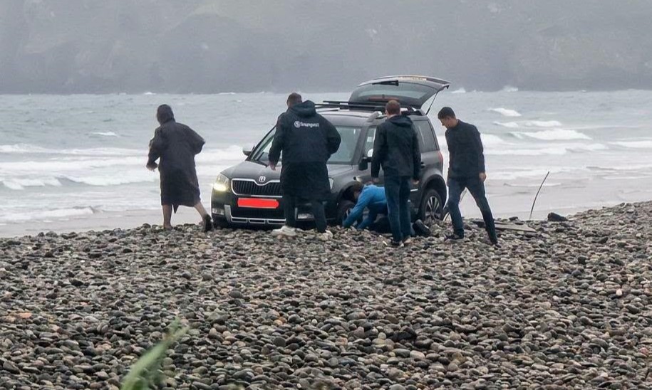 A hapless driver sparked a frantic beach rescue after getting their Skoda wedged axle-deep in a pebble bank just yards from the sea in Pembrokeshire.