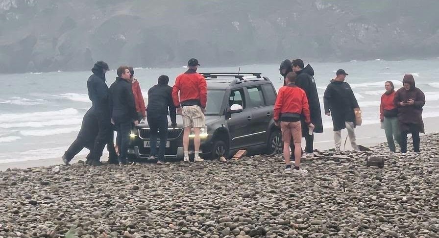 A hapless driver sparked a frantic beach rescue after getting their Skoda wedged axle-deep in a pebble bank just yards from the sea in Pembrokeshire.