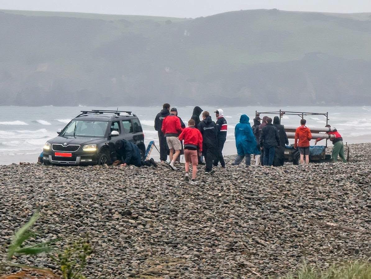 A hapless driver sparked a frantic beach rescue after getting their Skoda wedged axle-deep in a pebble bank just yards from the sea in Pembrokeshire.