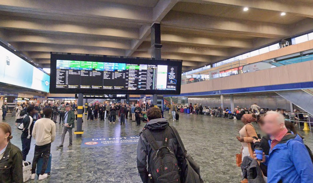 Thousands of commuters were stranded at Euston Station as 37C heat forced rail bosses to introduce a reduced timetable - with passengers urged to travel only if "absolutely necessary."