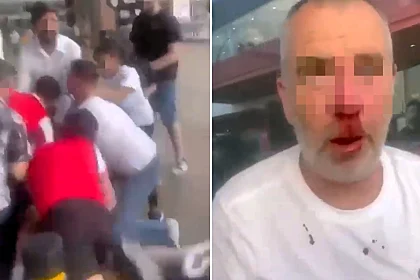 Huge brawl breaks out outside East London sports bar after Arsenal's heartbreaking Champions League defeat to PSG as punches fly and one fan left bloodied in shocking scenes.