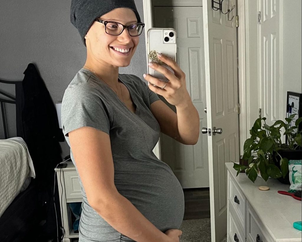 A mum diagnosed with a rare deadly breast cancer while pregnant feared she wouldn't see her kids grow up - but baby Naomi arrived healthy and she is now cancer-free.