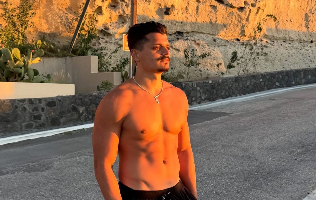 Influencer slammed for showing off his chiselled torso in just shorts and a hard hat while "helping" with earthquake relief - as viewers say he did nothing useful.