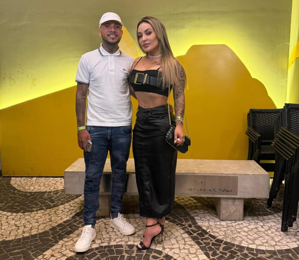 A Brazilian influencer's boyfriend died after taking six bullets to shield her from a drive-by shooting that police have linked to a bitter feud with a rival influencer.