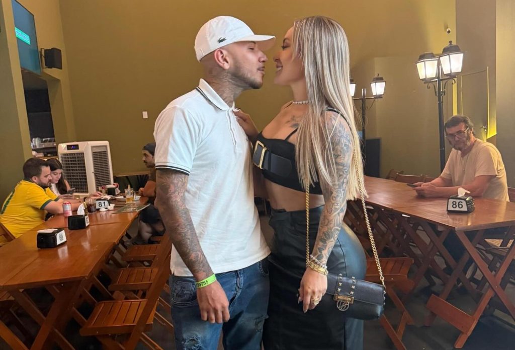 A Brazilian influencer's boyfriend died after taking six bullets to shield her from a drive-by shooting that police have linked to a bitter feud with a rival influencer.