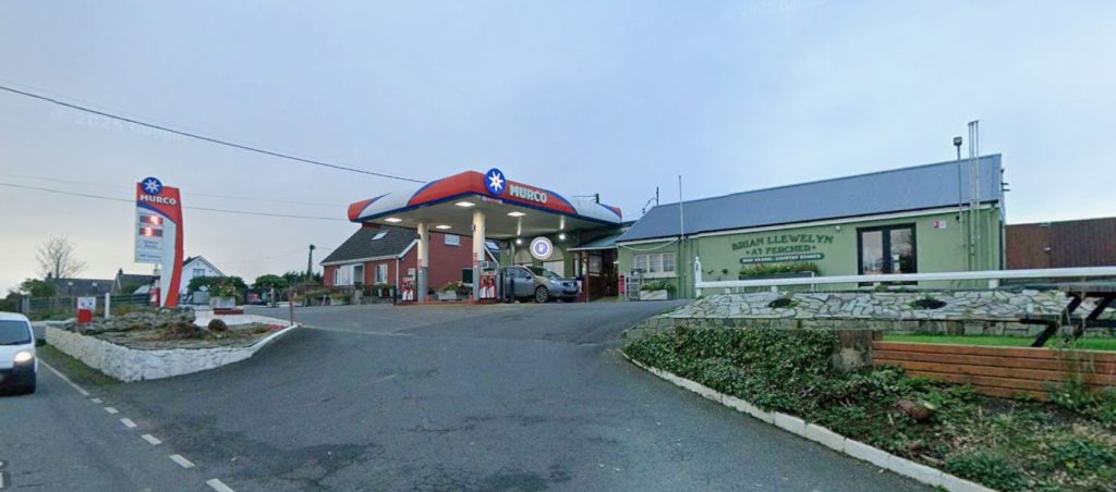 A panicked driver had to sprint across a Welsh garage forecourt after leaving his van's handbrake off, with staff frantically yelling van, van, quick, quick to alert him.