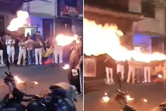 A fire breather's face was engulfed in a fireball at a Colombian political rally - terrified onlookers rushed in to smother the flames before he was rushed to hospital.