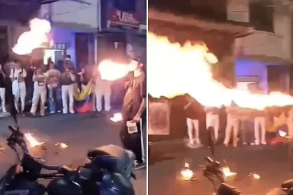 A fire breather's face was engulfed in a fireball at a Colombian political rally - terrified onlookers rushed in to smother the flames before he was rushed to hospital.