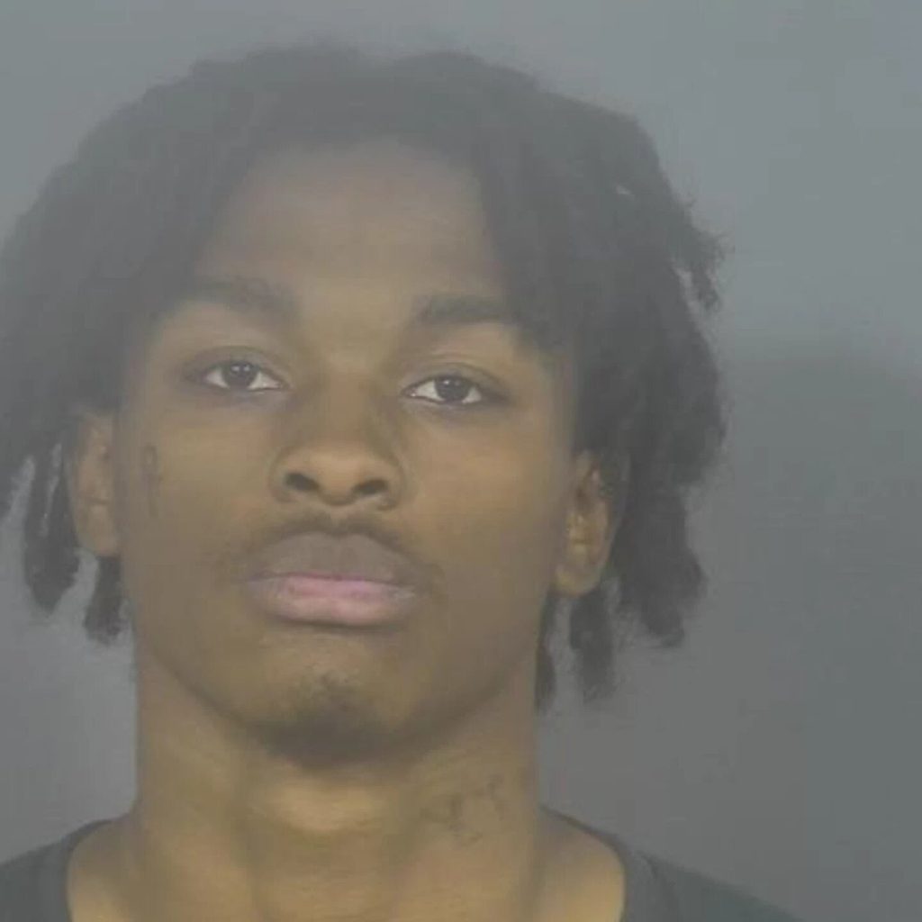 A mother was shot dead after stepping in to protect her teenage son when a Facebook Marketplace watch sale turned violent - the suspect allegedly fired as he fled the front porch.