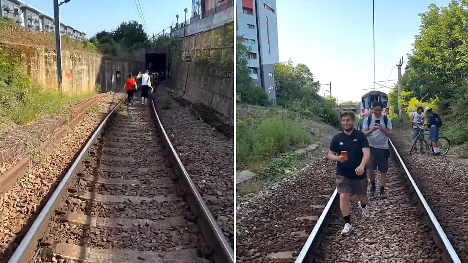 Two hundred passengers were forced to walk along railway tracks outside the Emirates Stadium after a train broke down in 34C heat, leaving them stranded for three hours.