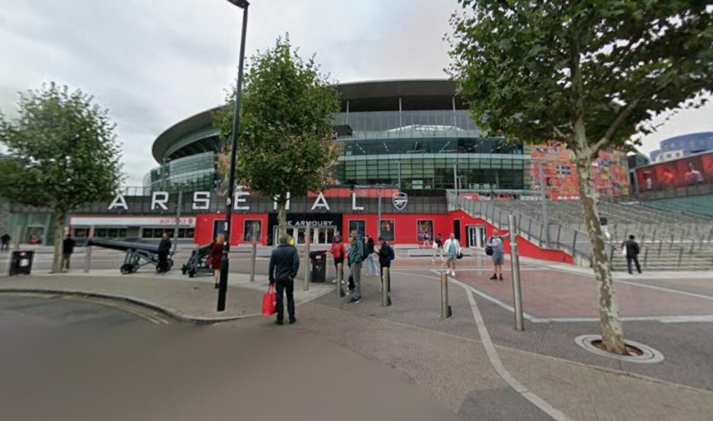 Two hundred passengers were forced to walk along railway tracks outside the Emirates Stadium after a train broke down in 34C heat, leaving them stranded for three hours.