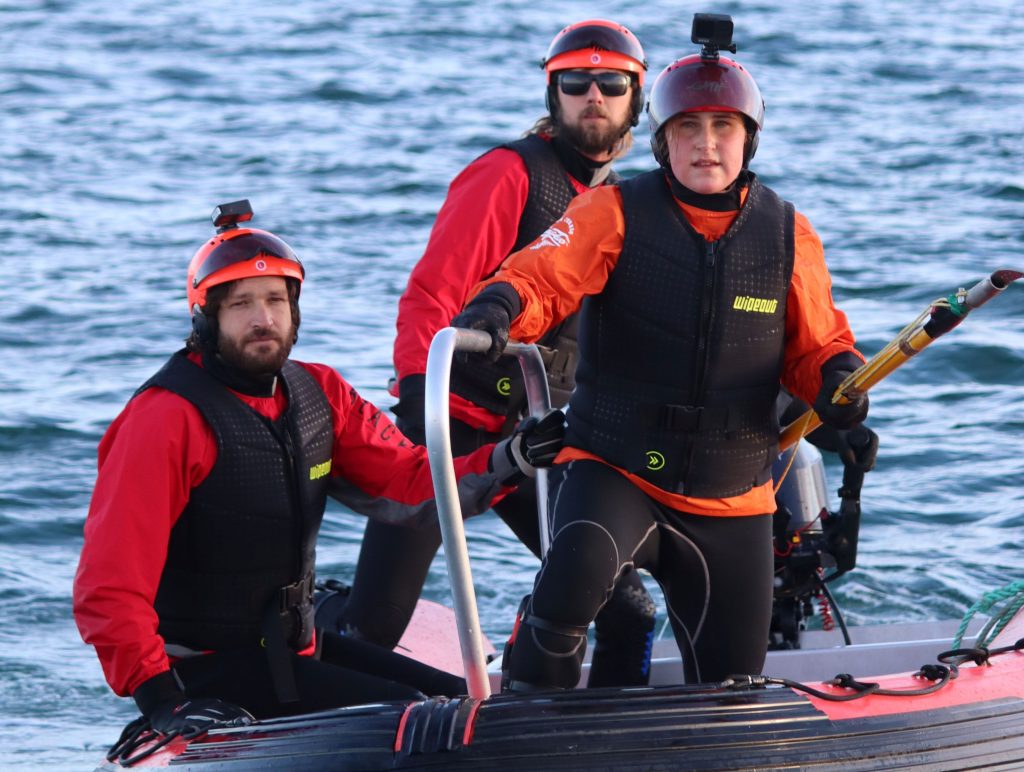 A rare southern right whale dragging 100m of rope and four buoys through open water has been rescued off New Zealand in the first recorded disentanglement of the species.