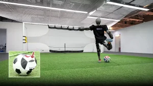 A robot footballer named the Booster T1 is smashing walls and splitting balls with its Roberto Carlos-like free kicks just ahead of the robot World Cup in South Korea.