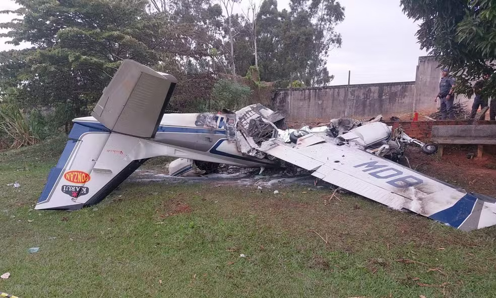 Two pilots died as a plane burst into flames in Brazil - one was heard calling for help as the fire spread - but sports club staff cut a survivor free from the wreckage.