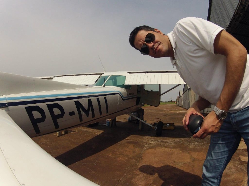 Two pilots died as a plane burst into flames in Brazil - one was heard calling for help as the fire spread - but sports club staff cut a survivor free from the wreckage.