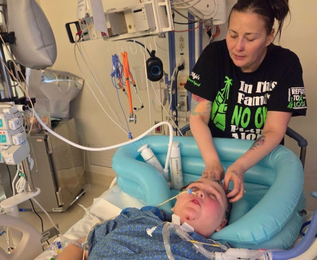 A 12-year-old boy has been left paralysed from the neck down after being shot four times during a sleepover - his heartbroken mum calls it the biggest regret of her life.