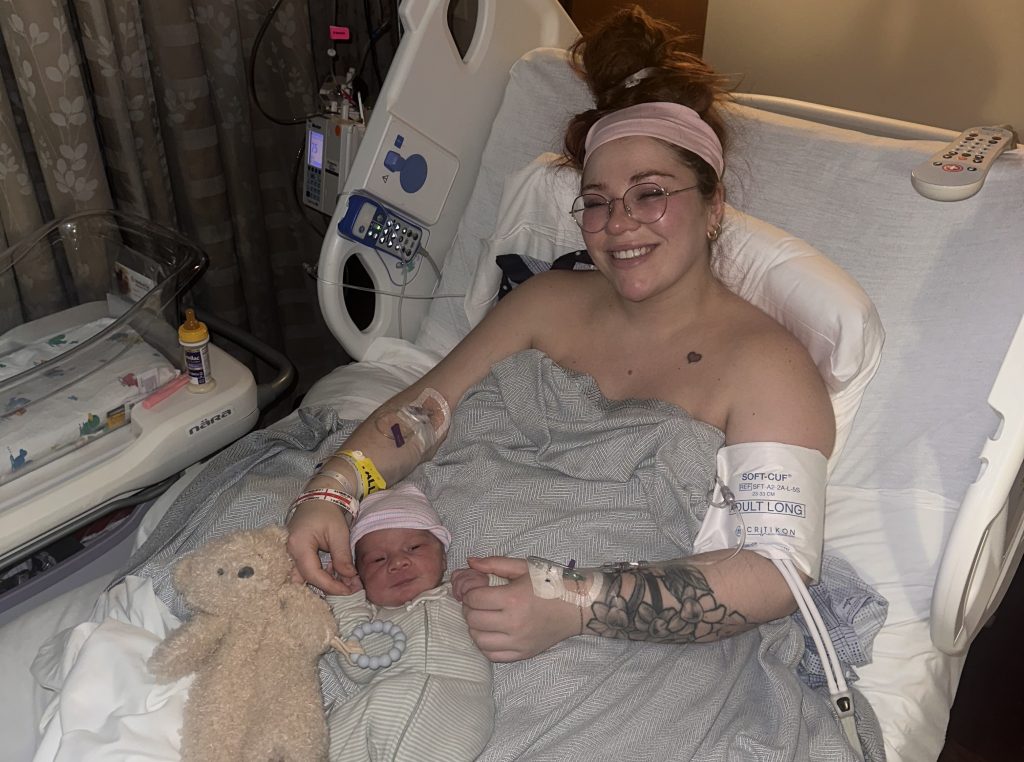 A mum reveals the shocking moment her uterus fell out while she held her newborn - her doctor looked like a 'deer in headlights' as a rare complication almost killed her.