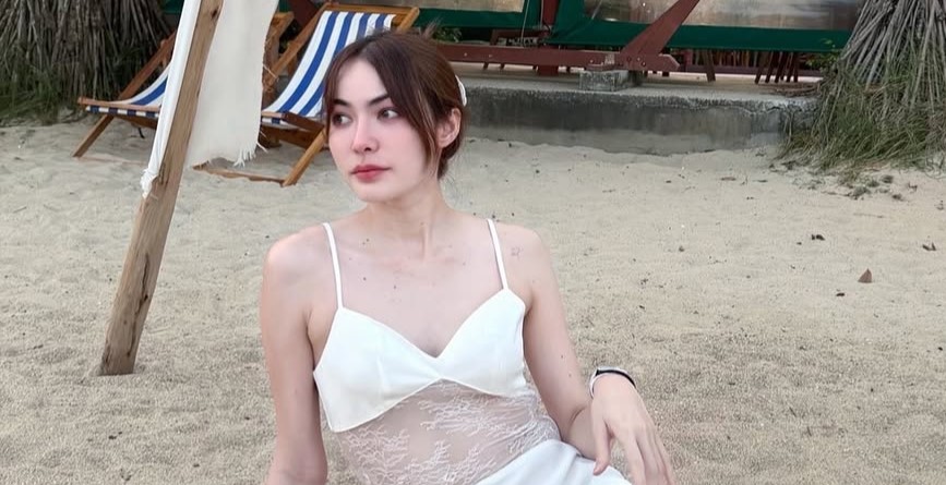 A beauty queen scammed out of £88,000 by fake cops posing as police over a 24-hour call has won damages, with a Thai court ordering her bank to pay £22,000.
