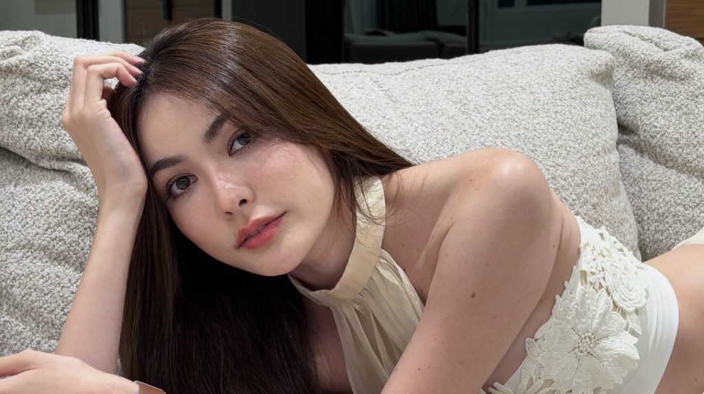 A beauty queen scammed out of £88,000 by fake cops posing as police over a 24-hour call has won damages, with a Thai court ordering her bank to pay £22,000.