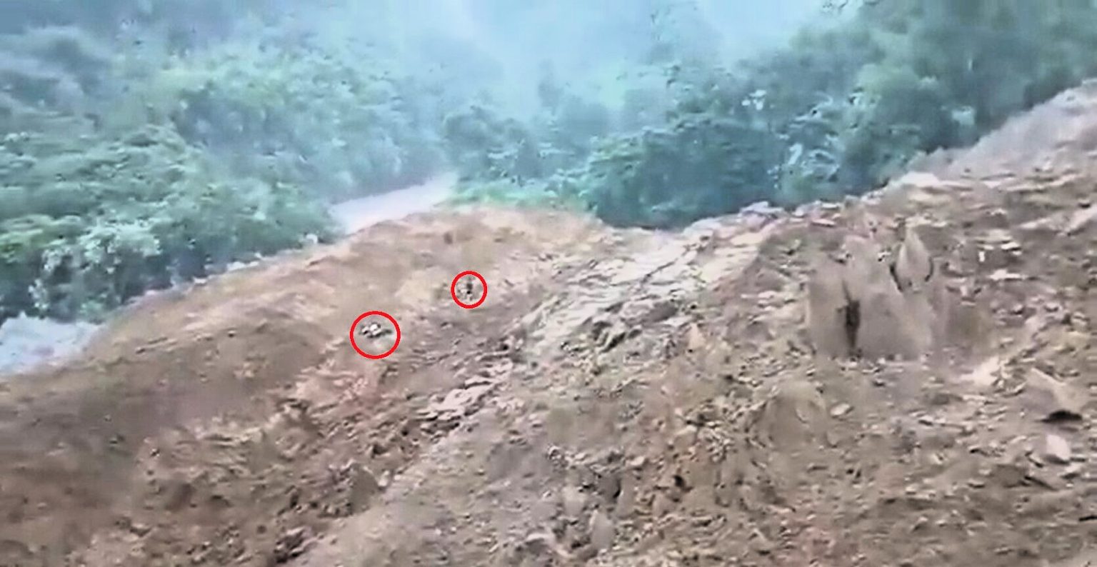 A biker cheated death by leaping from his bike seconds before a massive landslide swept down a mountainside and engulfed the road in Arunachal Pradesh, India.