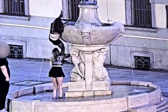 Two boozed-up women caught on CCTV stealing a sword from a historic naked fencer statue in Poland, with one collared by cops and now facing charges.